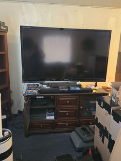 75 in sharp TV &  dark wood cabinet