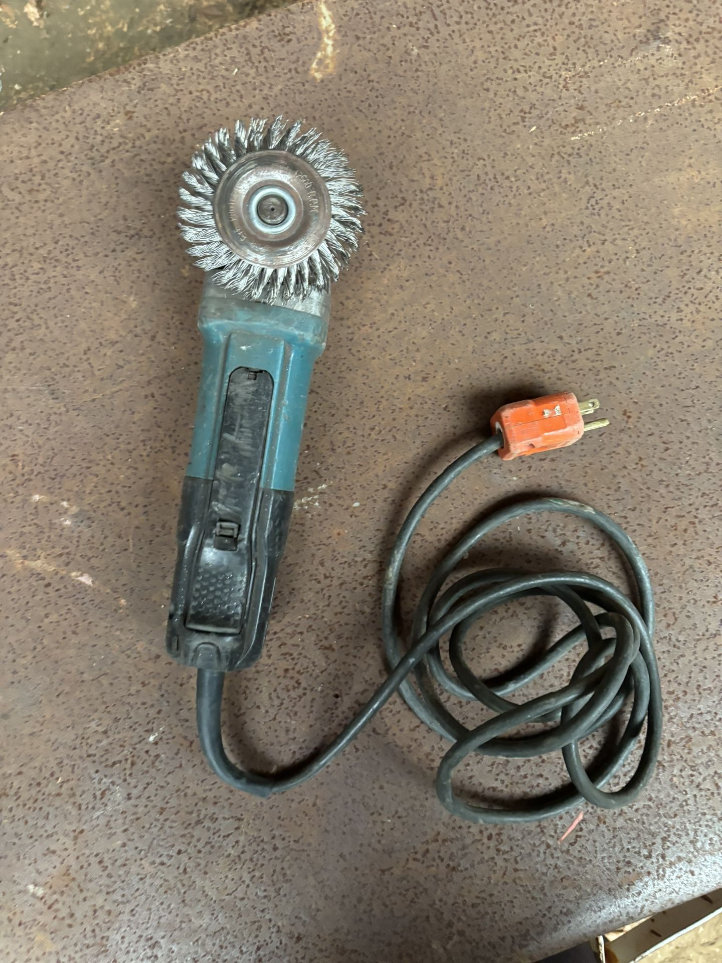 Makita Angle Grinder with Wire Brush Attachment