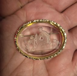 Broach Center Is Glass With An Etched Woman And Cherub Outdoors