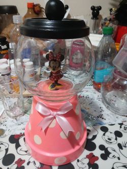 Minnie.\nMouse , to put candy or gum and top