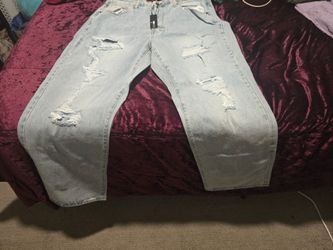 Seeking Thrills Shredded Straight Leg Jeans. Light wash