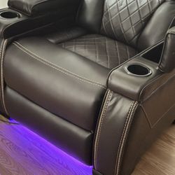 Leather Personal Couch With LED lights and Wire Plugs.