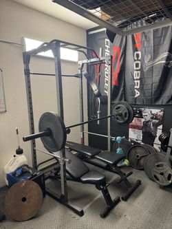 Squat rack and barbell bar 225$