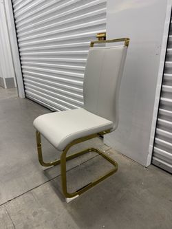 Wrought Studio Modern Faux Leather Cantilever Dining Chairs with Gold Base set of 2