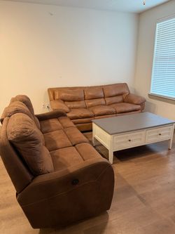 Light brown couch is still available. The darker one & the coffee table are gone