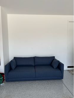 Excellent condition 3 seater sofa. Retail was $1600 navy blue performance fabric. Retail was $1699. Sofa company brand.