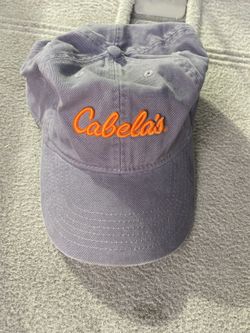 Cabela's adjustable gray baseball cap with an orange embroidered logo