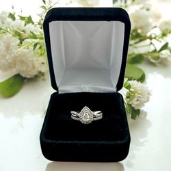14kt 4.40g White Gold with Pear Shape and Small Round Cluster Diamonds Ring.