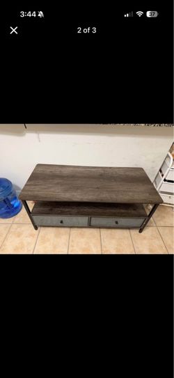 Brown coffee table with gray drawers