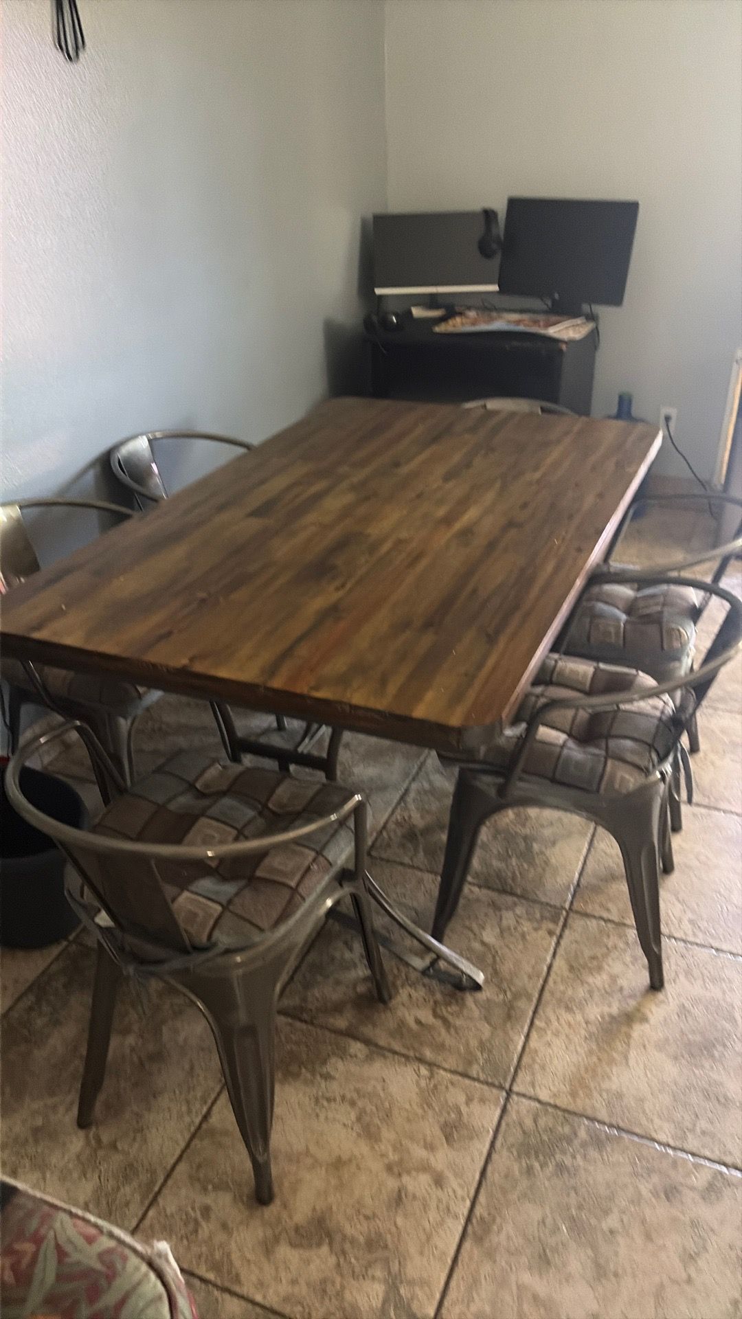 Kitchen Table wood on top and metal on the frame condition with six chairs with the cushions asking 250