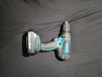 Turquoise and black power drill