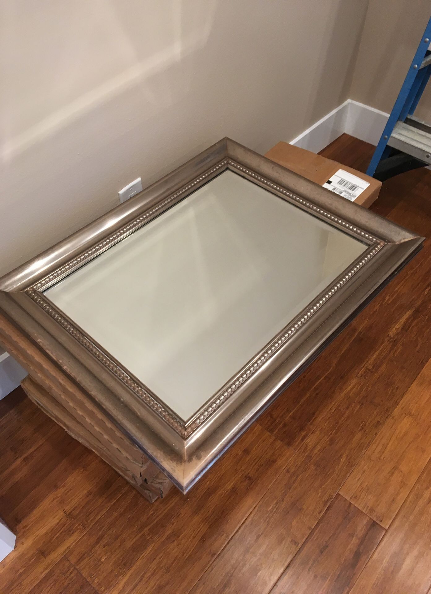 Wall mirror in a frame