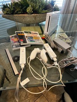 Nintendo Wii console remotes and games
