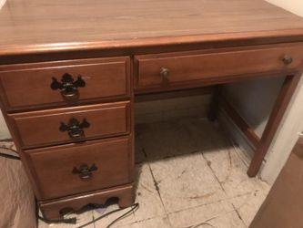 Vintage desk has little marks on it