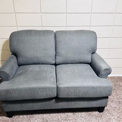 Dark gray loveseat