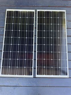 high efficiency solar modules (2) 100w  w/ battery charger / maintainer (1)
