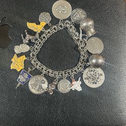 Sterling Silver Bracelet (Includes 16 Charms)