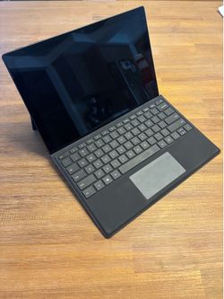 Microsoft Surface Pro 7 with Type Cover, Pen, and Arc Mouse with charger