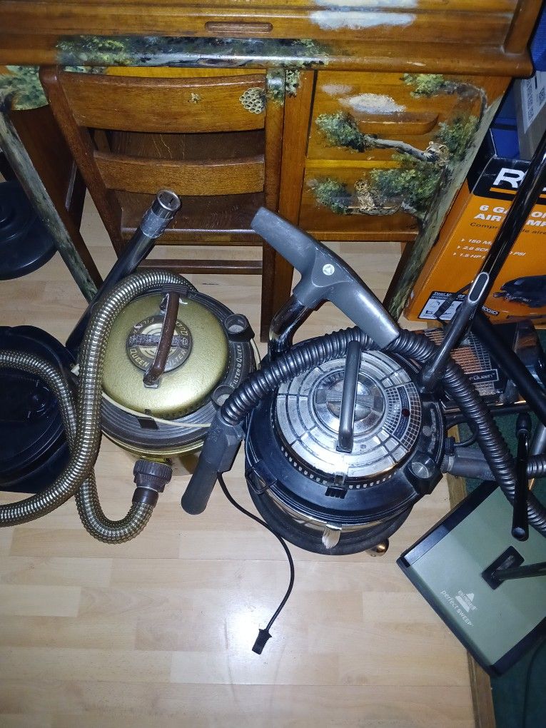 2 Filter Queen Vacuums.