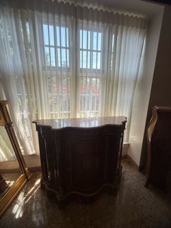 **Solid Wood Buffet Cabinet**  Elegant curved buffet cabinet with spacious storage inside. Great for a dining room, living room, or entryway while add