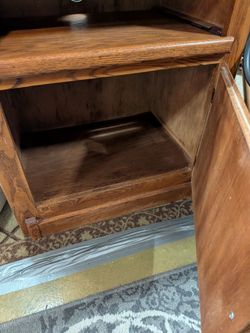 Adorable oak cabinet with sliding shelf storage w/ lazy Susan measures 34 in high 18 in deep 27 in Long