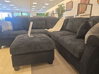 Sectional sofa with free othman the original one .