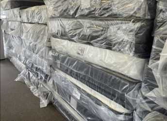 plastic wrapped queen mattres