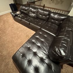Black Leather L shaped Couch