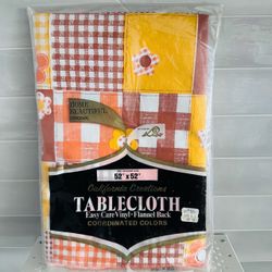 Vintage new in package California creations 52” x 52” vinyl flannel backed table cloth  Perfect retro colors yellow orange brown  Gingham Checkered fl