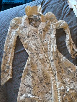 With empire neck line Victorian lace wedding gown