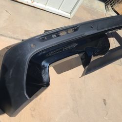 2024 - 2025 CHEVROLET TRAILBLAZER REAR BUMPER COVER W/ HOLE  SENSORS GENUINE USED OEM.  X2