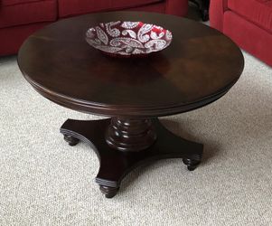 Round wooden pedestal table
