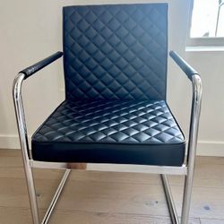 Chrome and black faux leather chair
