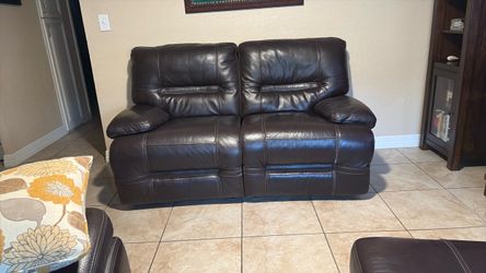 Faux brown leather adjustable reclining love seat