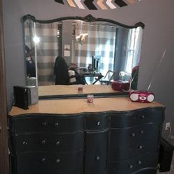 Black dresser set with a mirror