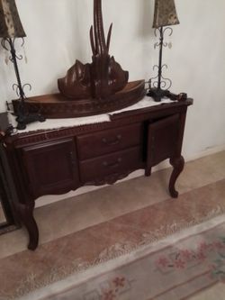 China cabinet with 2 lamps and single leg shelf.