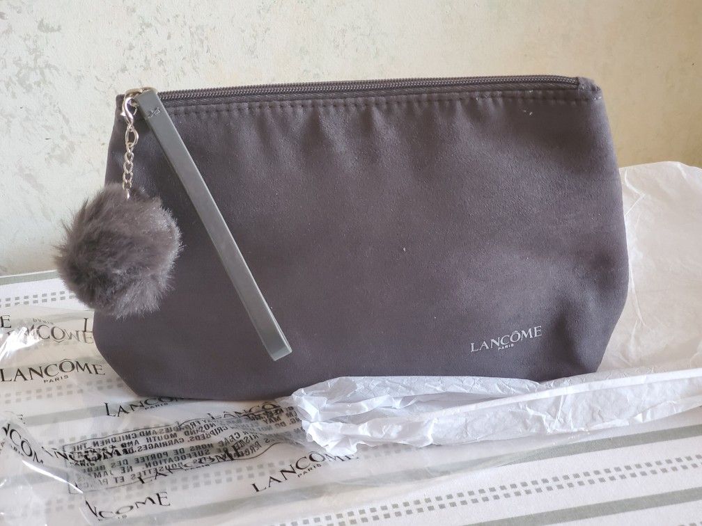 New Lancome Paris Makeup Bag Faux Suede Black With Faux Fur Pom Pom and patent wristlet strap. Condition is New in package. 10x7x2.