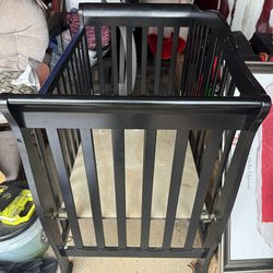 Black baby crib framework