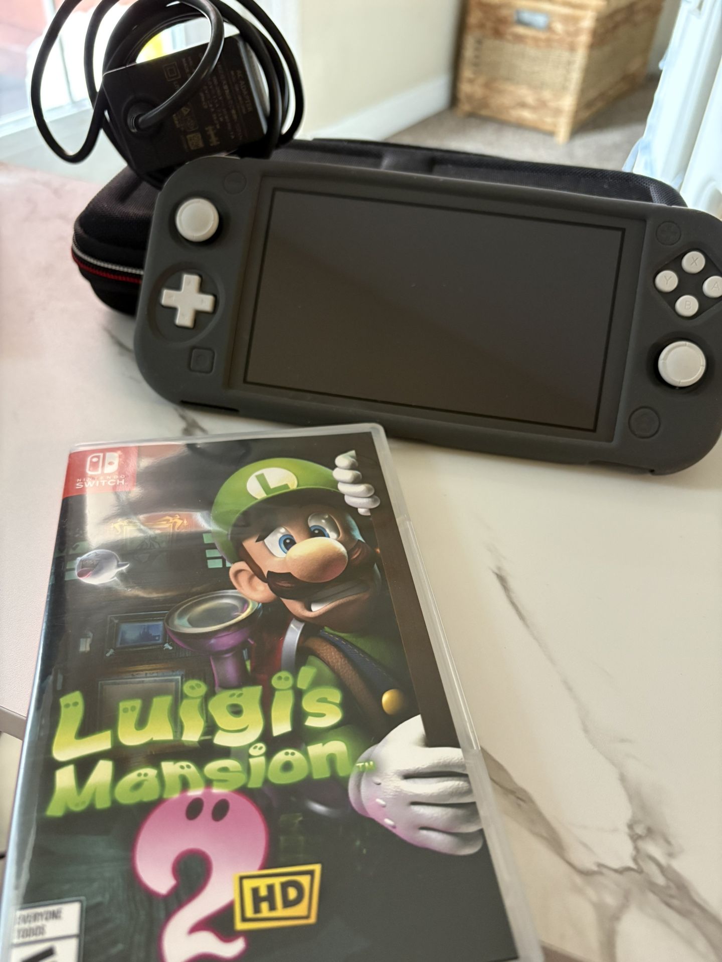 Gray Nintendo Switch Lite  w/accessories and Luigis Mansion 2 HD
