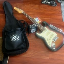 3/4 SIZE LEFT LEFT HANDED GUITAR WITH PRACTICE AMP TUNER STRAP AND BAG