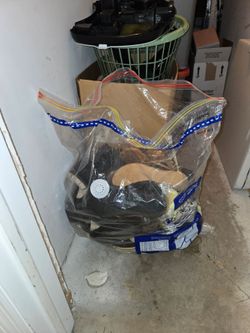 Large Bag full of shoes of assorted sizes