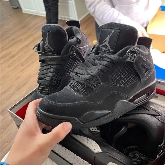 Black Cat Jordan 4s