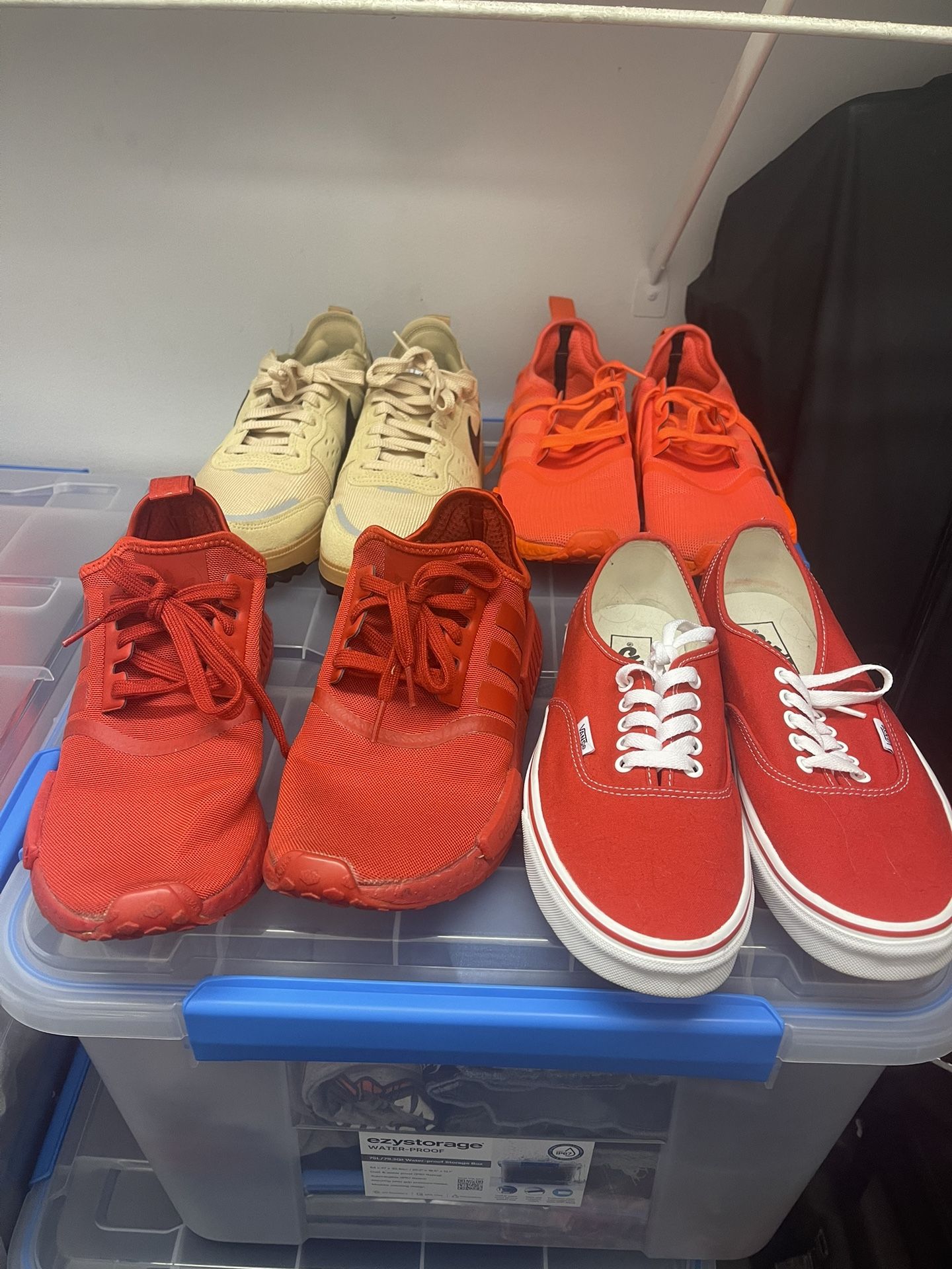 4 used pairs of shoes size 9 and 9.5 adidas triple solar red, Nike city brownstone, red vans 9.5, and adidas red.