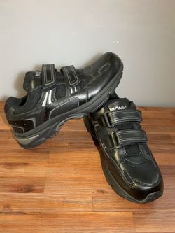 These are black Vionic Tabi walking shoes with a double-strap closure.