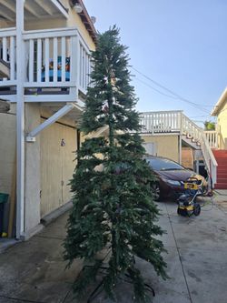 Glitzhome 11ft. Pre-Lit Green Slim Fir Artificial Christmas Tree with 850 Warm White/Multi-color LED Lights