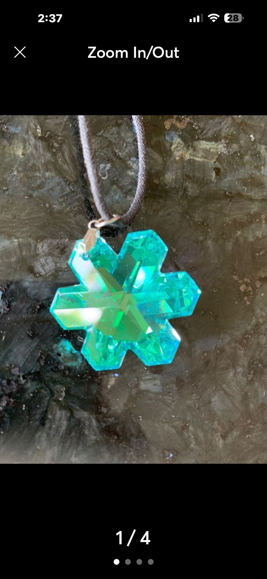 Vintage adjustable pendant necklace in good vintage condition. Shining blue crystal pendant with a black string.