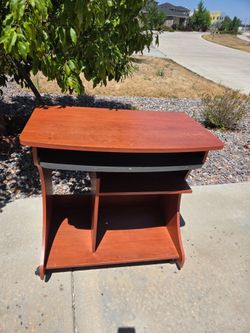 Sturdy wooden TV stand with shelves.