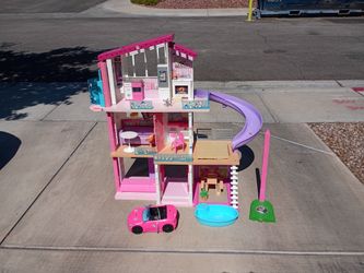 $25.00 Barbie House, with extra items, including Barbie car.