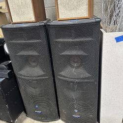 Mackie SR1530 three-way powered speakers. 