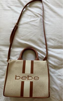 This is a beige and brown Bebe Paisley Mini Canvas Satchel featuring vertical varsity stripes and an embroidered logo